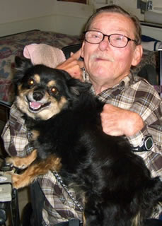 Photo of JT with one of his dogs.