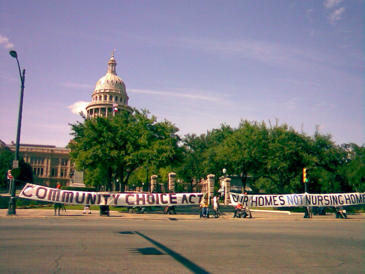 ADAPT Protesters Hold Banner in Front of Texas Capitol