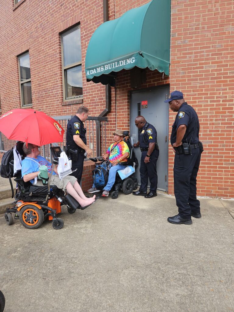 ADAPT folks blocking back door of HHS. Police talking to them