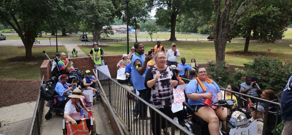 ADAPT folks pack narrow ramp to HHS building.